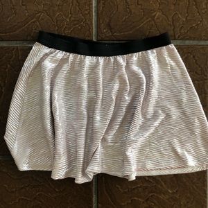 Happening in the present, pink metallic skirt